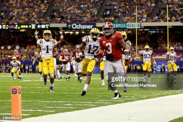 Trent Richardson of the Alabama Crimson Tide runs for a 34 yard touchdown in the fourth quarter against Morris Claiborne of the Louisiana State...