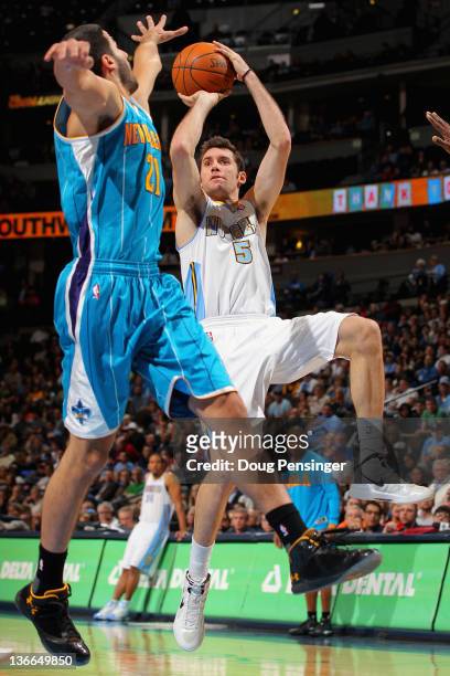 Rudy Fernandez of the Denver Nuggets takes a shot over Greivis Vasquez of the New Orleans Hornets at the Pepsi Center on January 9, 2012 in Denver,...