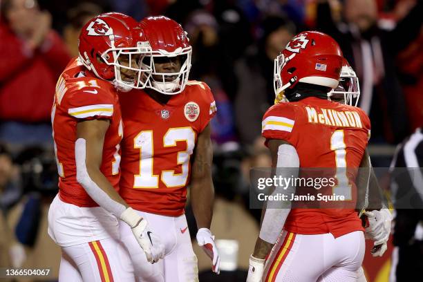 Byron Pringle of the Kansas City Chiefs celebrates with teammates Demarcus Robinson and Jerick McKinnon after scoring a touchdown during the second...