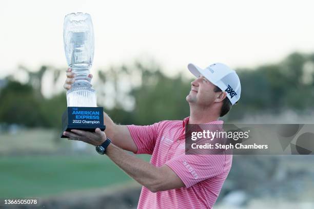 Hudson Swafford celebrates with the winner's trophy after winning The American Express at the Stadium Course at PGA West on January 23, 2022 in La...