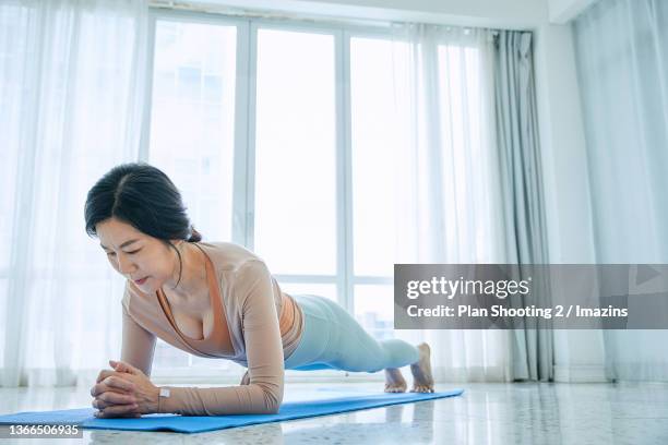 9,619 Mature Asian Woman Yoga Stock Photos, High-Res Pictures, and