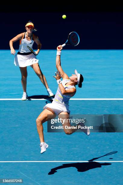 Caroline Dolehide of the United States plays a forehand smash in her third round doubles match against Marta Kostyuk of Ukraine and Dayana Yastremska...