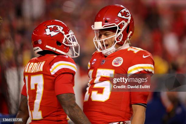 Mecole Hardman of the Kansas City Chiefs celebrates with Patrick Mahomes after scoring a touchdown against the Buffalo Bills during the third quarter...