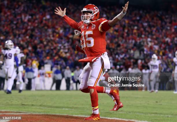 Patrick Mahomes of the Kansas City Chiefs celebrates a touchdown scored by Tyreek Hill against the Buffalo Bills during the fourth quarter in the AFC...