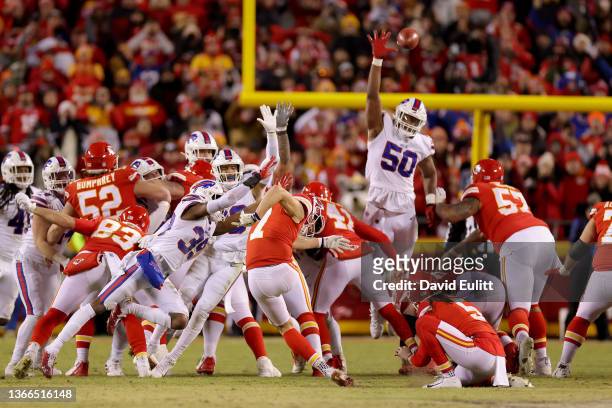 Harrison Butker of the Kansas City Chiefs kicks the game tying field goal against the Buffalo Bills at the end of the fourth quarter to send it in to...