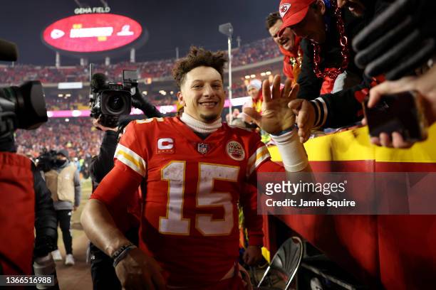 Patrick Mahomes of the Kansas City Chiefs celebrates with fans after defeating the Buffalo Bills in the AFC Divisional Playoff game at Arrowhead...