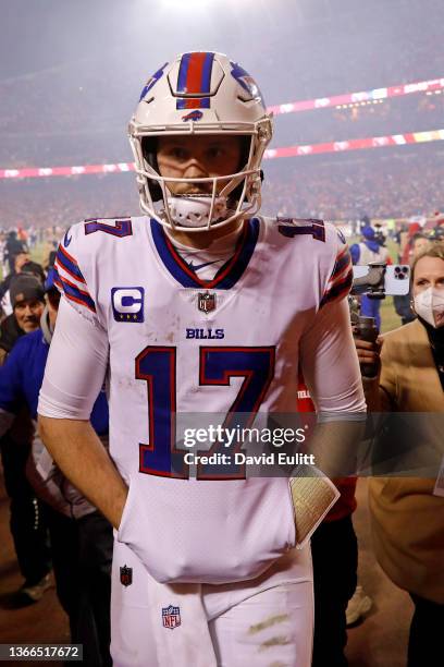 Josh Allen of the Buffalo Bills walks off the field after being defeated by the Kansas City Chiefs in the AFC Divisional Playoff game at Arrowhead...