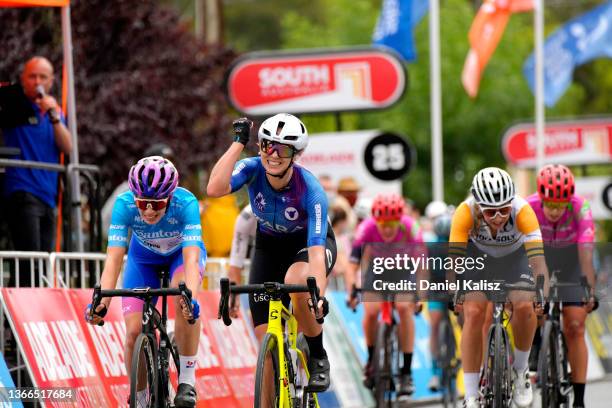 Maeve Plouffe of Australia and Team Ara Pro Racing Sunshine Coast celebrates winning ahead of Ruby Roseman-Gannon of Australia and Team...