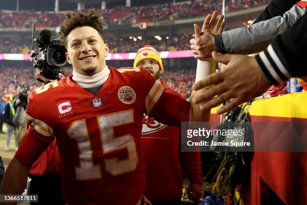 Patrick Mahomes of the Kansas City Chiefs celebrates with fans after defeating the Buffalo Bills in the AFC Divisional Playoff game at Arrowhead...
