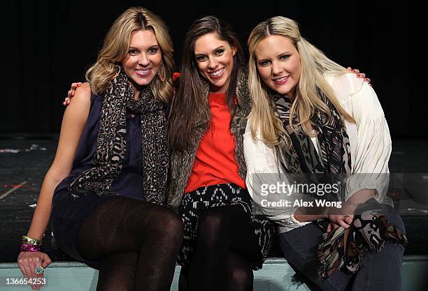 Daughters of Republican presidential candidate and former Utah Gov. Jon Huntsman, Mary Anne, Abby and Liddy, pose for photographers after a...