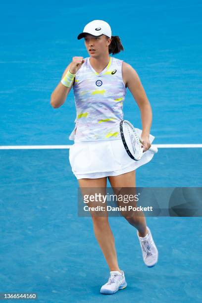 Iga Swiatek of Poland celebrates after a point in her fourth round singles match against Sorana Cirstea of Romania during day eight of the 2022...
