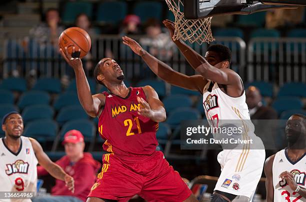 Darnell Lazare of the Fort Wayne Mad Ants shoots around defender Osiris Eldridge of the Bakersfield Jam during the 2012 NBA D-League Showcase inside...