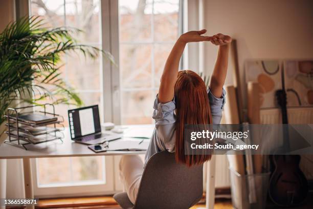 working all day - stretching at desk stock pictures, royalty-free photos & images