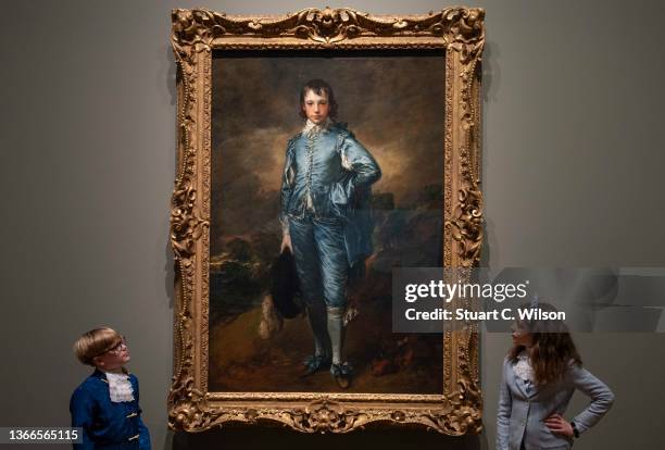 Children of National Gallery staff pose in front of 'The Blue Boy' by Thomas Gainsborough at the National Gallery on January 24, 2022 in London,...