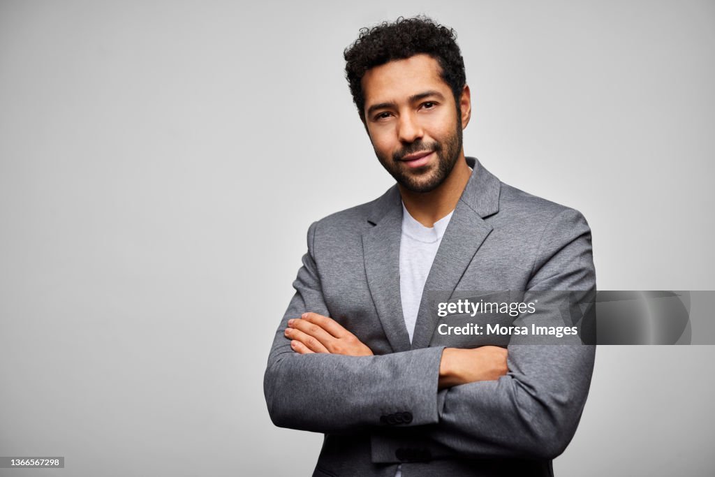 Confident African American Businessman against White Background