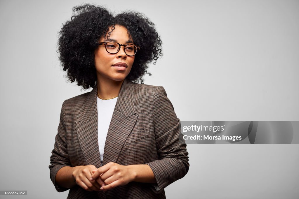 Confident African American Businesswoman Against White Background
