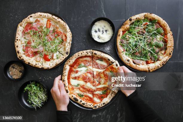 man eating italian pizzas - eating pesto stock pictures, royalty-free photos & images