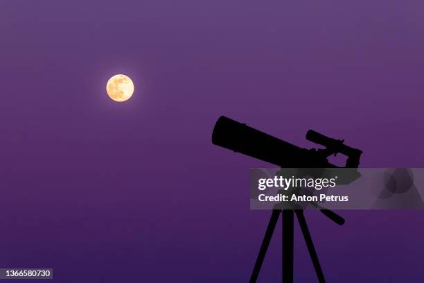 telescope on the background of the moon. amateur astronomy and space exploration - telescopes stock pictures, royalty-free photos & images