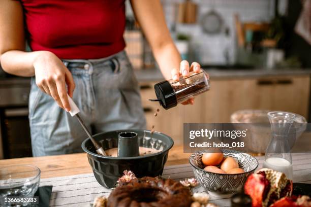 some more chocolate chips before baking - cakes stockfoto's en -beelden