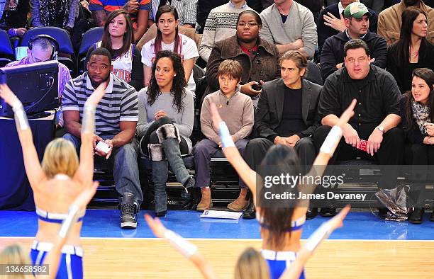 Justin Tuck, Lauran Williamson, Michael Imperioli and Steve Schirripa attend the Charlotte Bobcats vs the New York Knicks game at Madison Square...