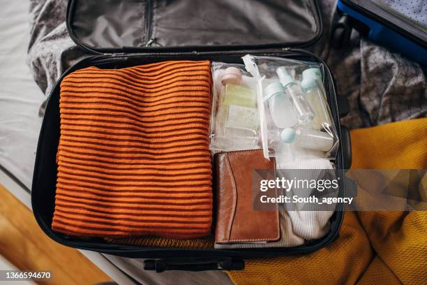 clothes, cosmetics in the suitcases - toiletries stock pictures, royalty-free photos & images