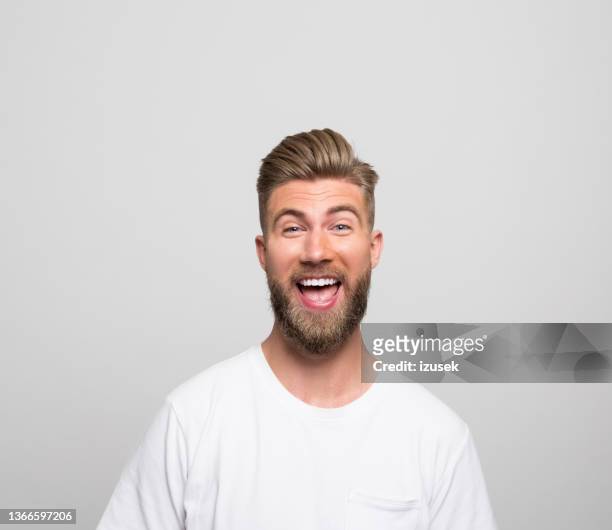 headshot of excited young man - surprised face stockfoto's en -beelden