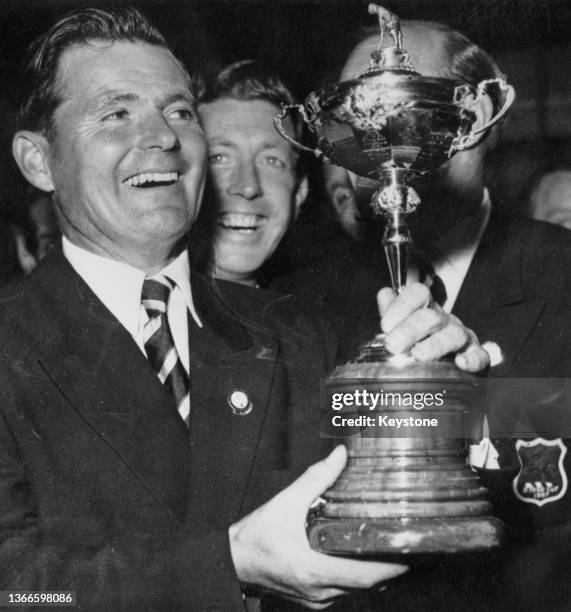 Dai Rees from Wales and team captain for the Great Britain Ryder Cup team holds the Ryder Cup trophy after Great Britain defeated the United States...