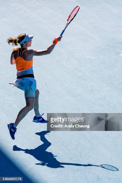 Alize Cornet of France plays a forehand in her fourth round singles match against Simona Halep of Romania during day eight of the 2022 Australian...