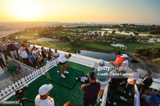 Paul Casey of England the winner of the JA Bibe Roof Top Bar Challenge at The JA Lake View Hotel watches Ladies European Tour player Amy Boulden of...