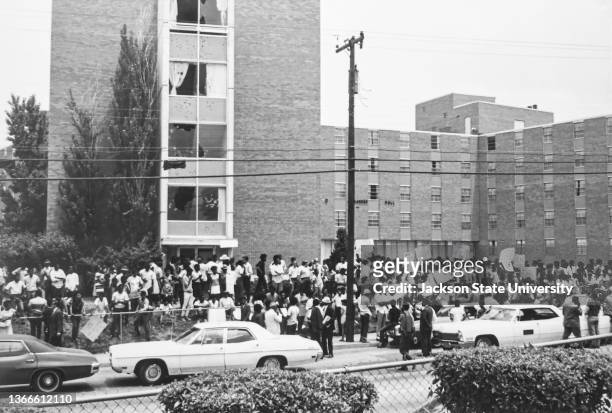 People gather outside women's dormitory Alexander Hall at Jackson State College in Mississippi. Police had fired into the dormitory killing two and...