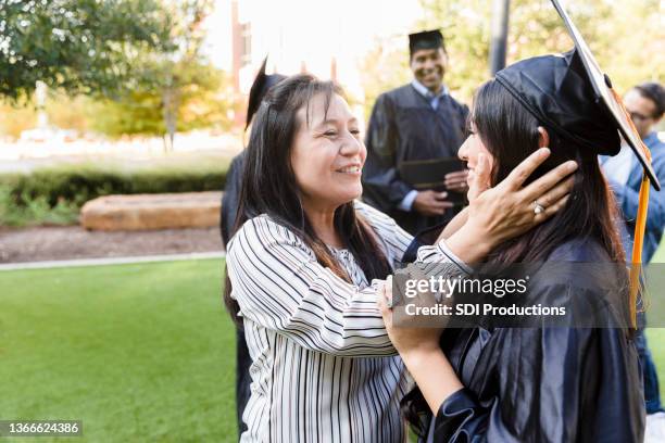 proud mother on daughter's graduation day - proud parent stock pictures, royalty-free photos & images