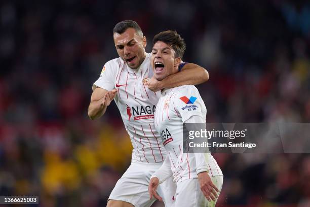 Joan Jordan and Oliver Torres of Sevilla FC celebrates scoring his teams second goal during the LaLiga Santander match between Sevilla FC and RC...