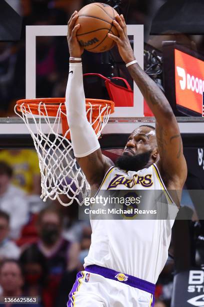 LeBron James of the Los Angeles Lakers dunks against the Miami Heat during the second half at FTX Arena on January 23, 2022 in Miami, Florida. NOTE...