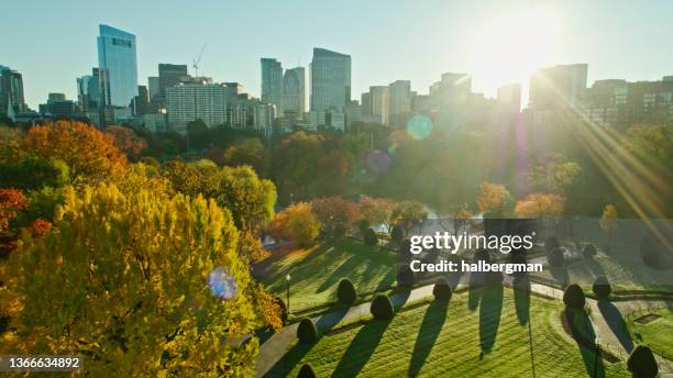 sun rising over boston common - aerial - boston massachusetts fall stock pictures, royalty-free photos & images