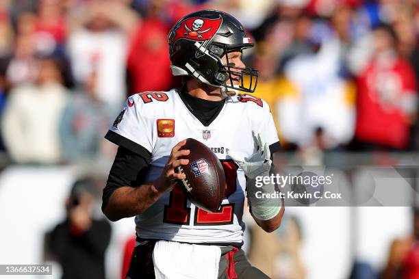 Tom Brady of the Tampa Bay Buccaneers looks to throw the ball in the second quarter of the game against the Los Angeles Rams in the NFC Divisional...