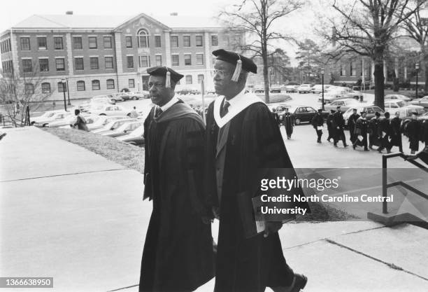 Chancellor Dr Le Roy T Walker escorts Dr John Hope Franklin into BN Duke Auditorium at North Carolina Central University in the 1980s.