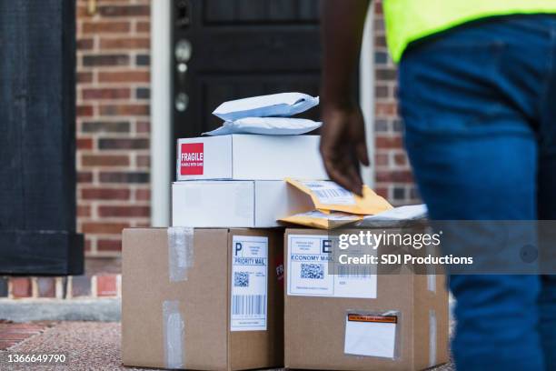 Stack Of Packages Front Door Photos and Premium High Res Pictures ...