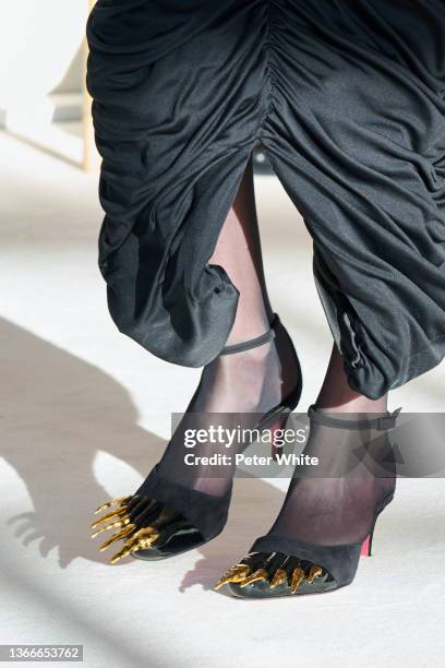 Model, shoe detail walks the runway during the Schiaparelli Haute Couture Spring/Summer 2022 show as part of Paris Fashion Week on January 24, 2022...