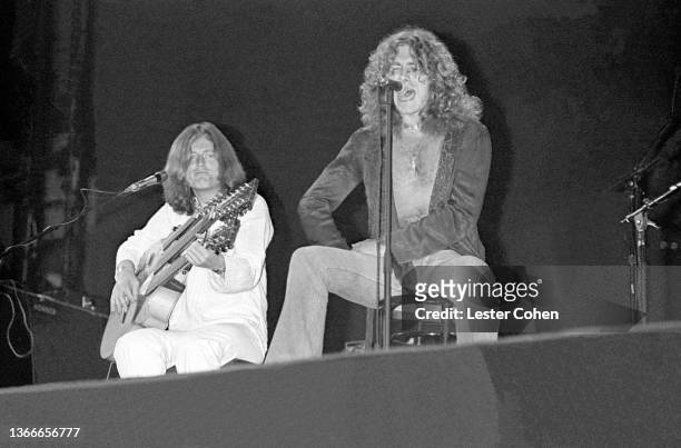 English musician and record producer John Paul Jones and British singer and songwriter Robert Plant, of the English rock band Led Zeppelin, perform...