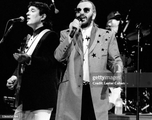 English musician, singer, songwriter and actor Ringo Starr and His All Starr Band, sings during a concert circa 1990 at the Greek Theatre in Los...