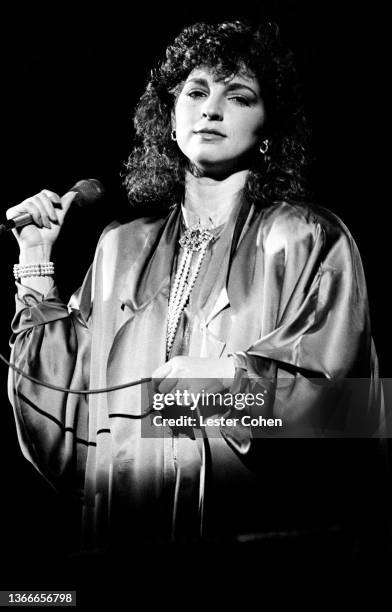 Cuban and American singer, actress, and businesswoman Gloria Estefan, of Gloria Estefan and the Miami Sound Machine, sings on stage circa 1988 in Los...