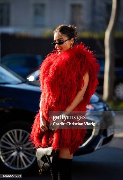 Patricia Gloria Contreras is seen wearing red faux fur coat outside Dior during Paris Fashion Week - Haute Couture Spring/Summer 2022 on January 24,...