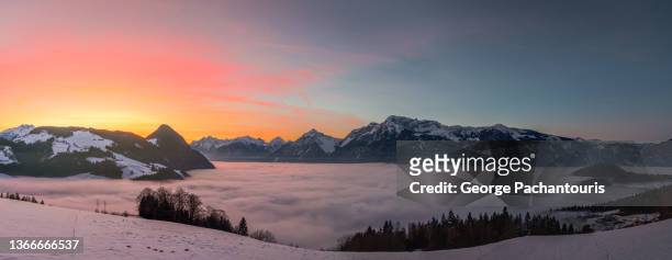 panorama of majestic sunset over the mountain and clouds - österreichische zentralalpen stock-fotos und bilder