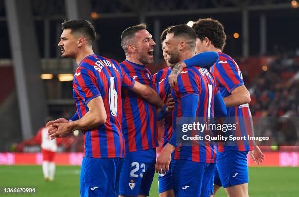 Enrique Gonzalez Casin of SD Eibar celebrates with team mates after scoring his team's second goal during the LaLiga Smartbank match between UD...