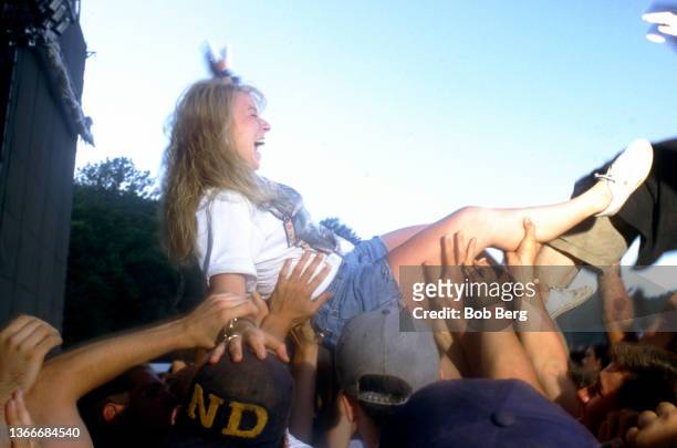 General view of a woman crowd surfing during the 1993 Lollapalooza Festival on July 13, 1993 at the Waterloo Village in Stanhope, New Jersey.