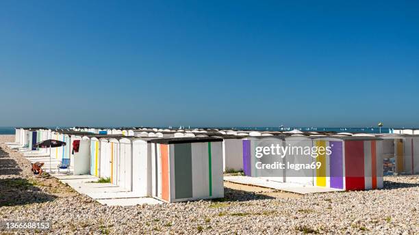 le havre beach with colored beach cabins - le havre stock pictures, royalty-free photos & images