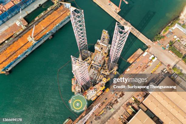 aerial view jack up rig for exploration oil in the sea, repairing or maintenance in shipyard. - gas truck stock-fotos und bilder