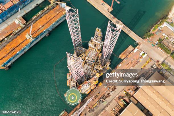 aerial view jack up rig for exploration oil in the sea, repairing or maintenance in shipyard. - tank barge stock pictures, royalty-free photos & images