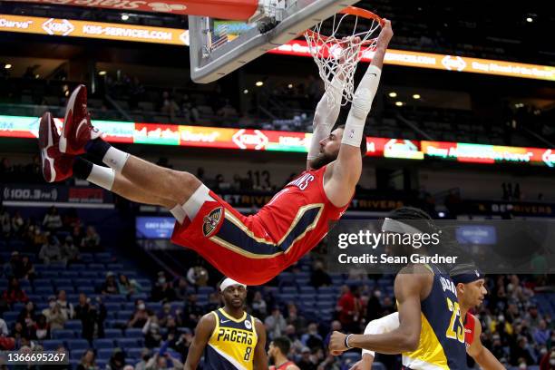 Jonas Valanciunas of the New Orleans Pelicans duncks the ball during the first quarter of a NBA game against the Indiana Pacers at Smoothie King...