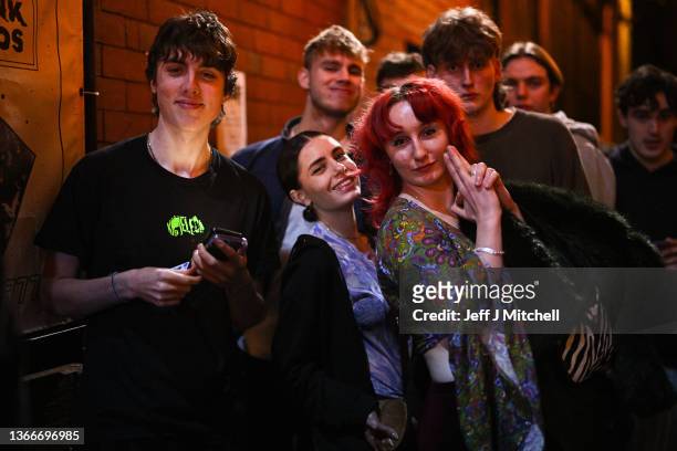 Clubbers queue to enter the Buff Club nightclub on January 24, 2022 in Glasgow, Scotland. With the easing of Coronavirus restrictions, nightclubs are...